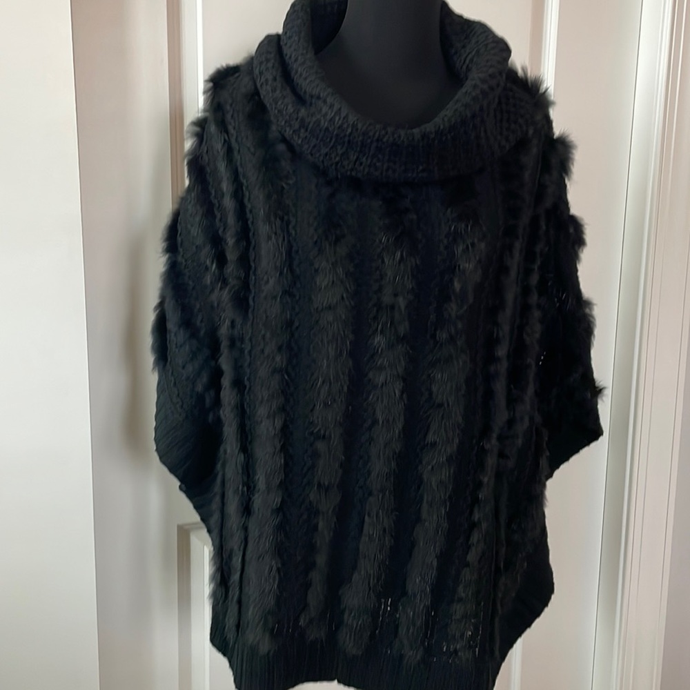 Black acrylic knit poncho with rabbit accents